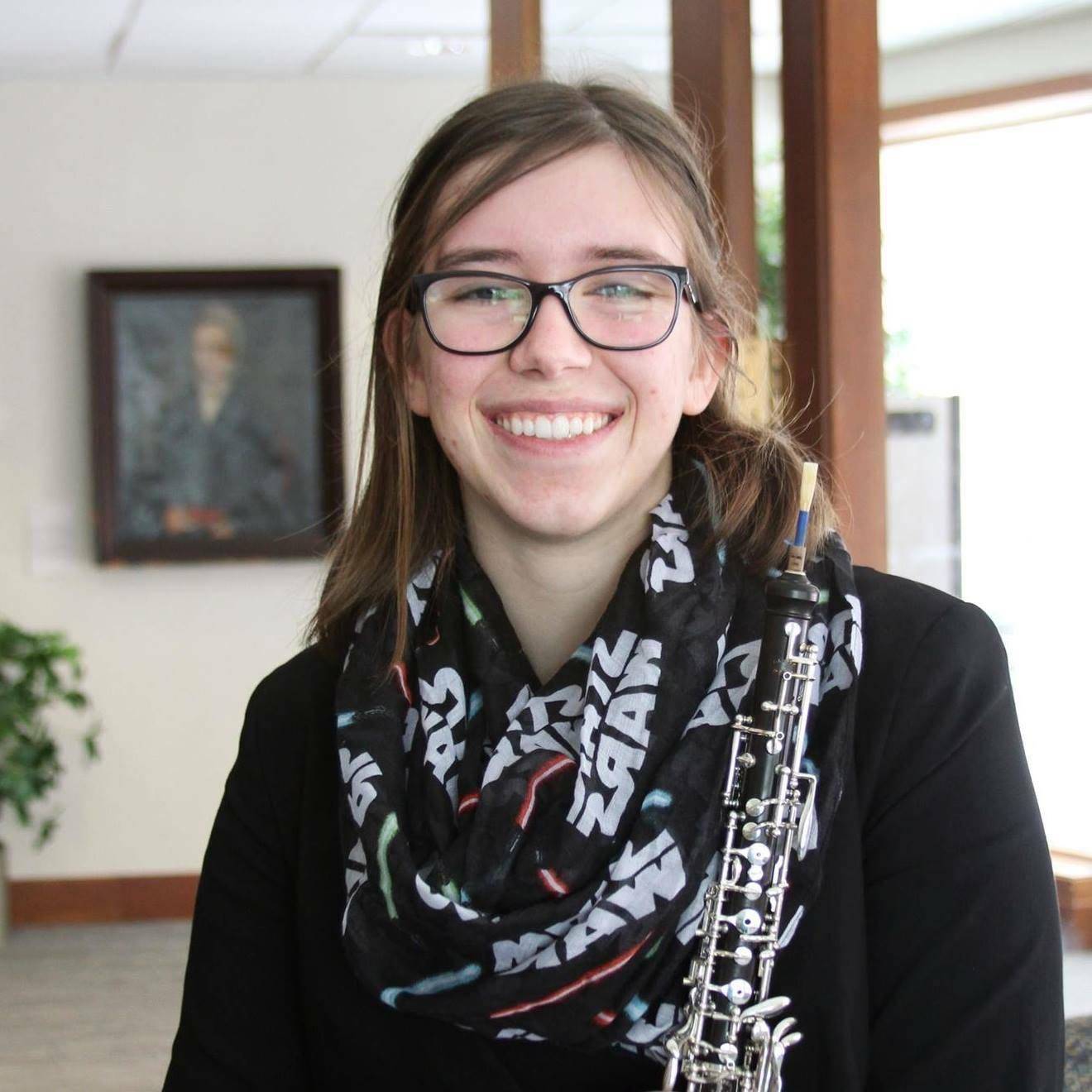 Tressa holding her oboe.